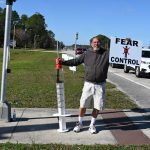 One of Palm Coast's more notorious anti-vaxxers at the county airport last year, where the Health Department was conducting vaccination clinics. (© FlaglerLive)