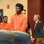 Brendan Depa preparing to tender a plea today before Circuit Judge Terence Perkins. Perkins sent him back to the defendant's table: Depa had not read his plea agreement. (© FlaglerLive)