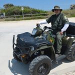 Steve Williams, a veteran Flagler County Sheriff's deputy, on his ATV during a beach-patrol assignment. (© FlaglerLive)