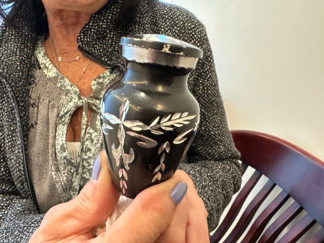 The urn with Brian O'Shea's ashes that his mother Maureen carried throughout the trial. (© FlaglerLive)